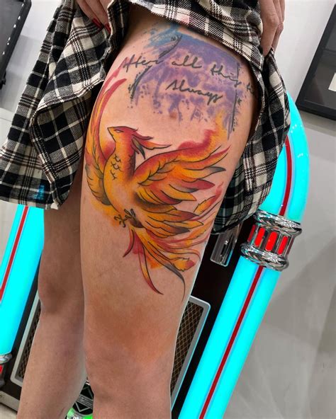 Phoenix Color Tattoo On Thigh With A Quote