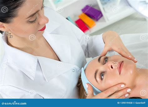 Female Beautician Doctor With Patient In Wellness Center Professional