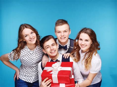 Students Holding Red T Boxes Female And Male Model Studio Posing