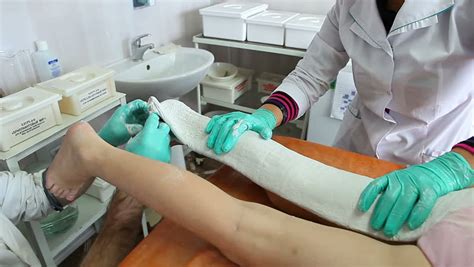 Removing Plaster From Child Leg Cutting Bandage With Scissors Medic