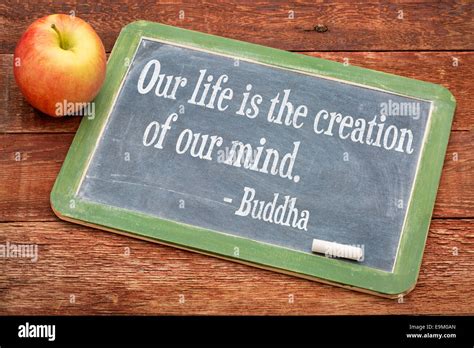 Our Life Is Creation Of Our Mind Buddha Quote On A Slate Blackboard