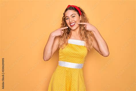 Beautiful Blonde Pin Up Woman With Blue Eyes Wearing Diadem Standing