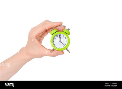Hand Holding A Small Alarm Clock The Concept Of Time Management Green