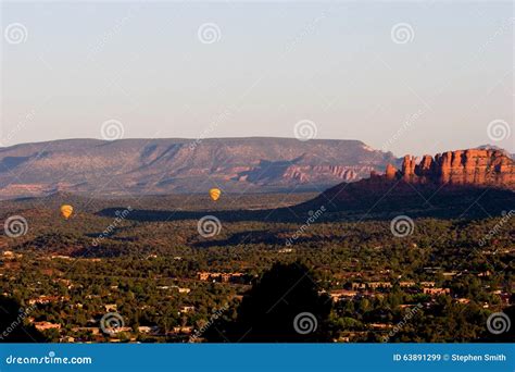 Two Hot Air Balloons Over The Valley Of Sedona Arizona Stock Image