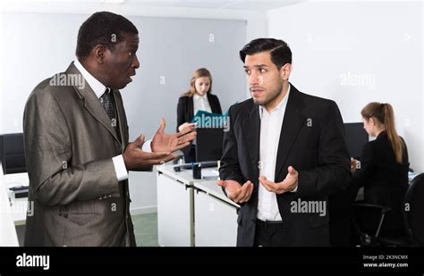 Angry Man Boss Pointinting To Misses In Work To Man Stock Photo Alamy