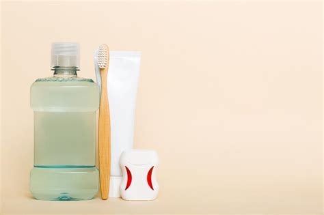 Premium Photo Mouthwash And Other Oral Hygiene Products On Colored