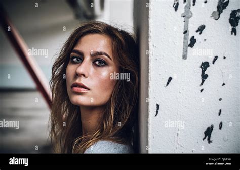 Portrait Of A Woman Leaning Against A Wall Stock Photo Alamy