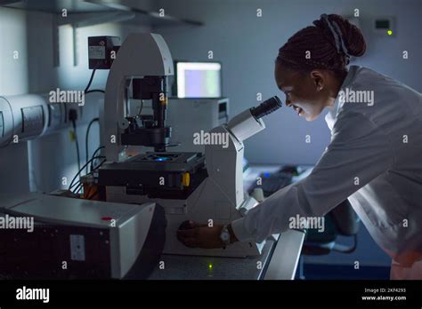 A University Student Using A Microscope Stock Photo Alamy