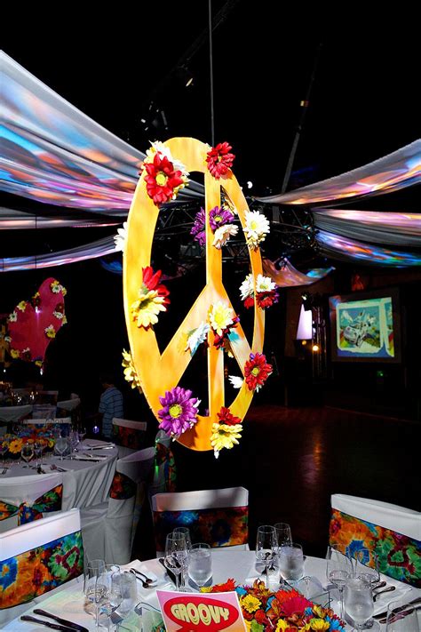 Suspended Peace Signs Centerpieces Adorned With Flowers For 60s