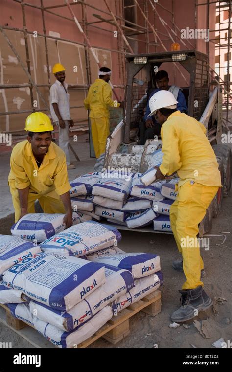 Worker Using Cement Bag