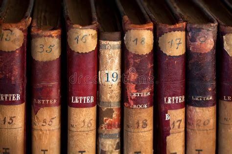 Old Books In A Row In Library On Black Background With Copy Space Stock