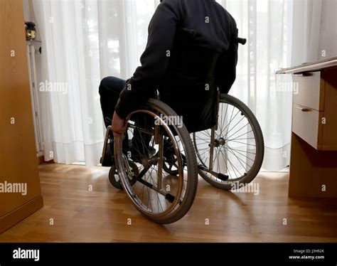 Disabled Person In His Bedroom With A Desk And Closet Stock Photo Alamy
