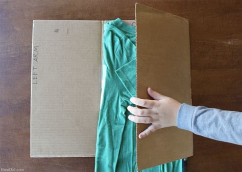 Make an Easy DIY T-Shirt Folding Device from a Cardboard Box - Bren Did