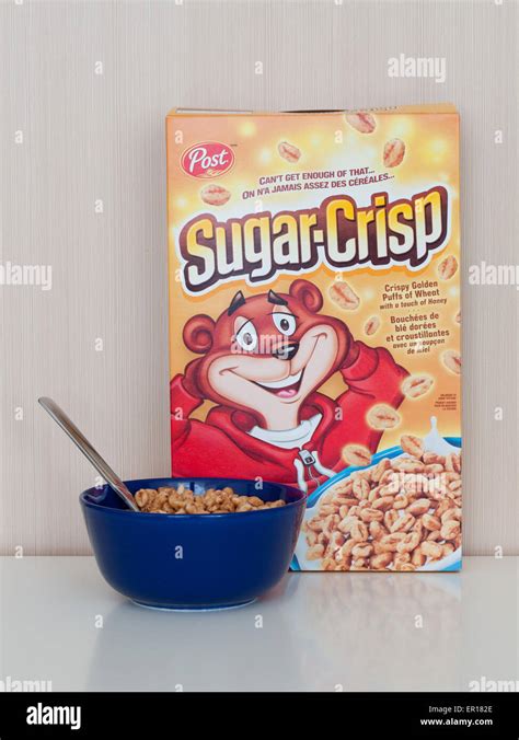 A box and bowl of Sugar Crisp (Golden Crisp), a breakfast cereal made by Post Cereals which ...