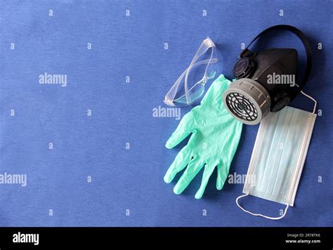 Latex Gloves Glasses Mouthguards And Antibacterial Gel On A Blue