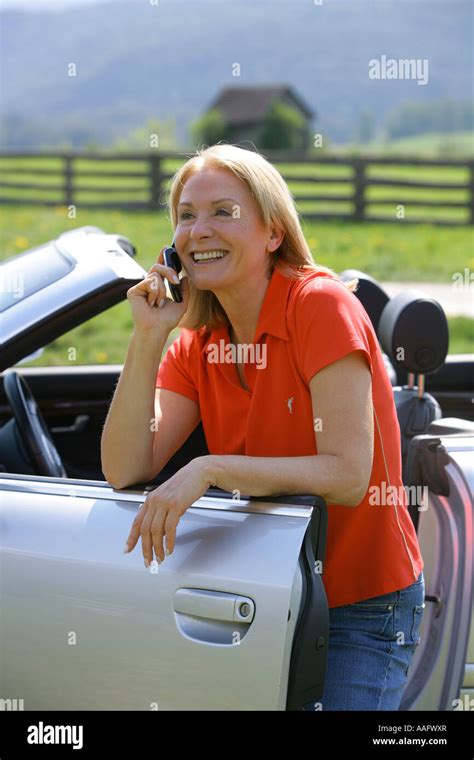 Mature Woman Using Cell Phone Stock Photo Alamy