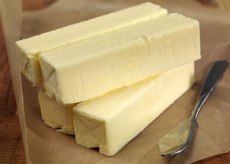Stacked Butter Quarters On Table Prepared Food Photos Inc