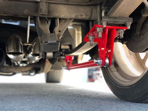 The Front Wheels And Suspensions Of A Car Are Shown In This Close Up Photo