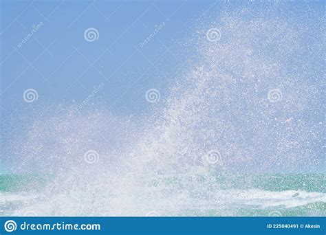 Splashing Water Of Sea Wave Crashing On Shore Spraying White Water Foam