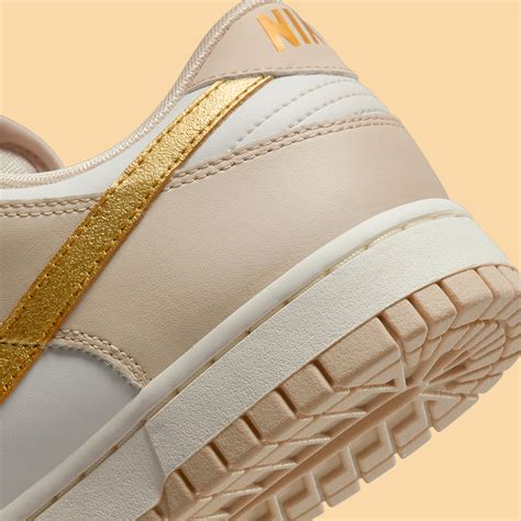 Nike Dunk Low Gold Swoosh DX5930 001 SneakerNews