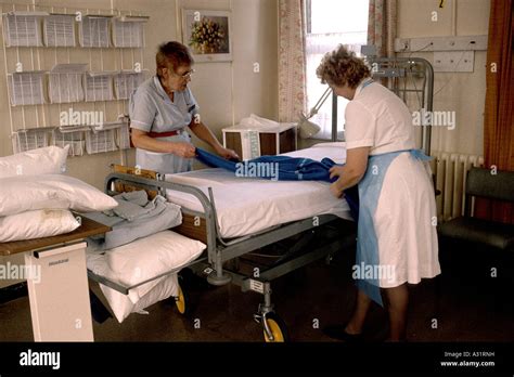 Nurses Making A Hospital Bed In A Ward Stock Photo Alamy