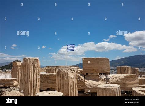 Athens Acropolis Greece Greek Flag Waving On Pole Ancient Column