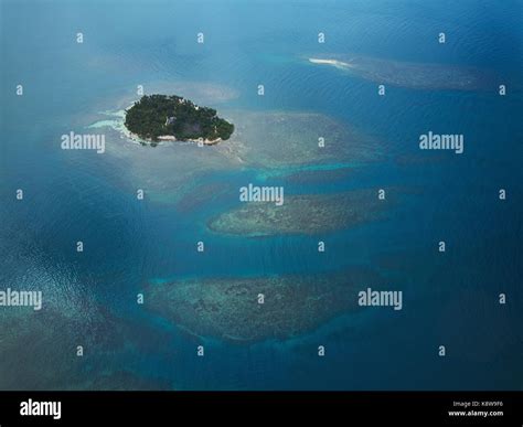 Coral reefs in blue sea water aerial drone view Stock Photo - Alamy