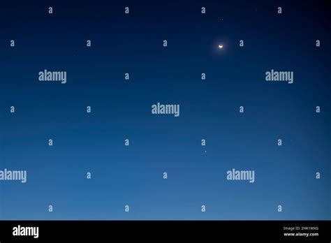 Crescent Moon in Conjunction with Venus and Mars Stock Photo - Alamy