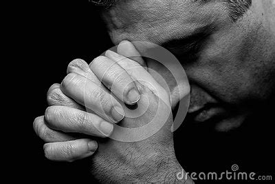 Close Up Of Faithful Mature Man Praying Hands Folded In Worship To God