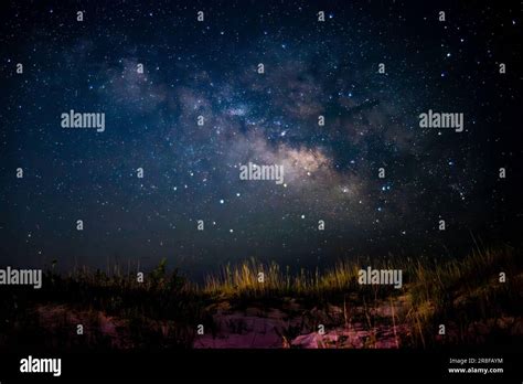 A Beautiful Night Sky Illuminated With Stars And Milky Way Galaxy Over