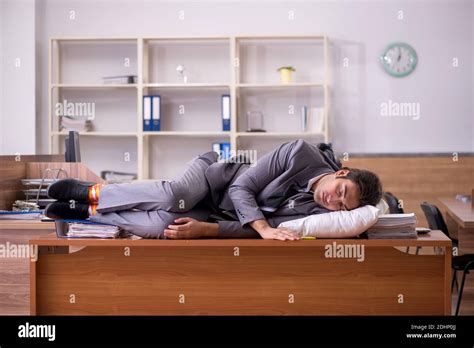 Young Employee Sleeping At Workplace Stock Photo Alamy