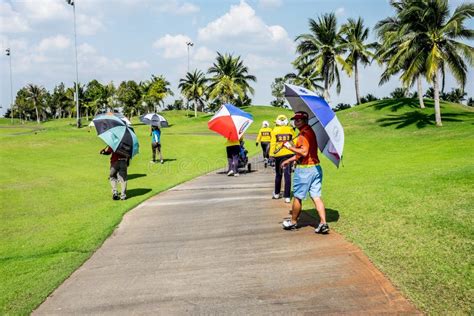 Golfers And Caddies Walking On The Path Editorial Photo Image Of