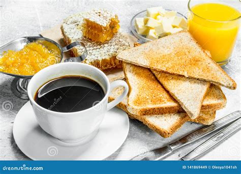 Breakfast Toasted Bread With Butter Honey And Orange Jam Stock Image