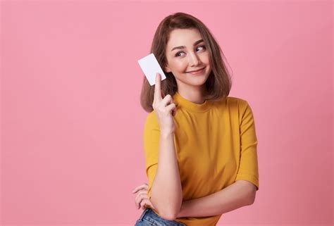 Premium Photo Portrait Of A Young Woman In Yellow Shirt Showing A