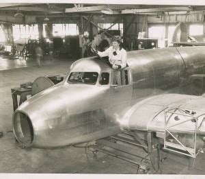 Amelia Earhart Standing In The Cockpit Of Of The Lockheed Electra E