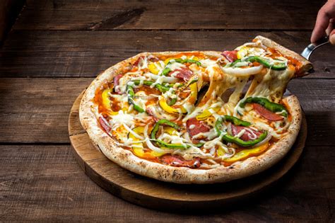 Free Stock Photo Of Close Up Of A Pizza With Pepperoni And Green