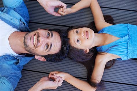 Father Daughter Bond High Angle Shot Of A Smiling Father And Daughter