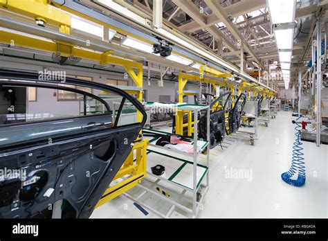 Car Door On Conveyor Robotic Equipment Makes Assembly Of Car Modern