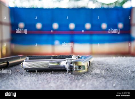 The Automatic Handgun In The Shooting Gallery Stock Photo Alamy