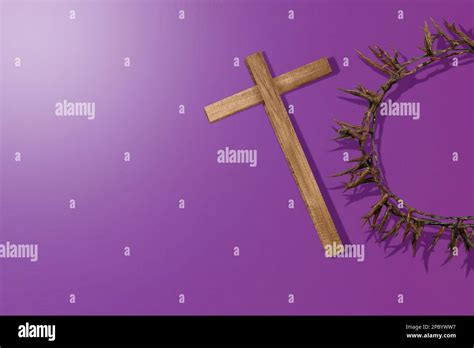 Christian Cross And Crown Of Thorns With Colored Background Stock Photo