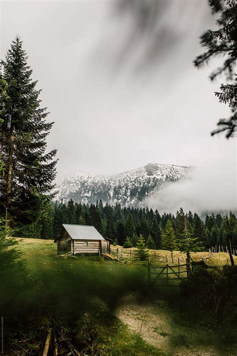 "Mountain Landscape Cabin" by Stocksy Contributor "Boris Jovanovic" - Stocksy