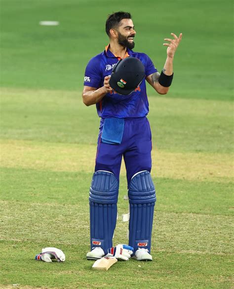 Virat Kohli cannot hide his smile after reaching his hundred ...