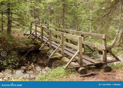 An Old Wooden Bridge Over a River Stock Image - Image of path, stream ...