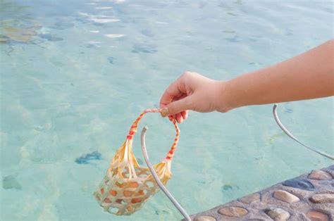 Premium Photo Women Hold Basket Weave Boiled Egg In Hot Spring At San Kamphaeng Hot Springs In