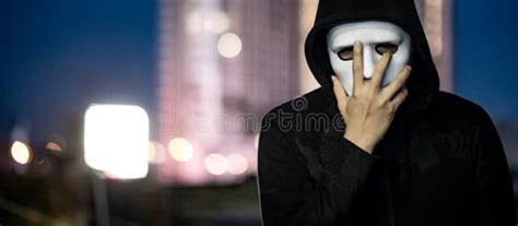 Mystery Man In White Mask Standing On Rooftop Stock Photo Image Of