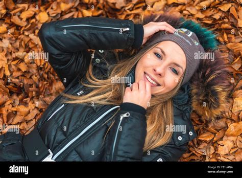 Lifestyle Session A Blonde Girl Smiling In The Leaves Of The Otzarreta Forest In The Natural