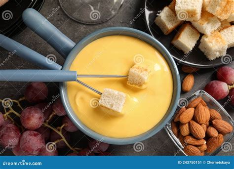 Flat Lay Composition With Pot Of Tasty Cheese Fondue On Grey Table