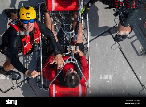 Roger Wilson A Priority 1 Air Rescue Rescue Specialist Prepares The Rescue Basket For