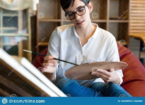 Creative Pensive Art School Painter Working On Painting Stock Image