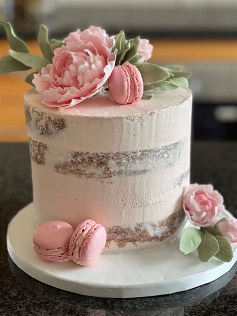 Buttercream Naked Cake Decorated With Sugar Paste Peonies And Macarons